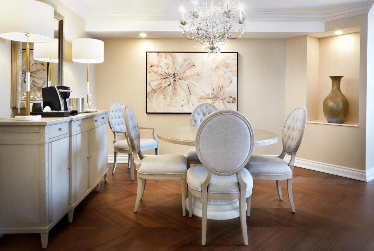Chateau Vaudreuil Bagian luar foto A dining room at The Ritz-Carlton, Boston